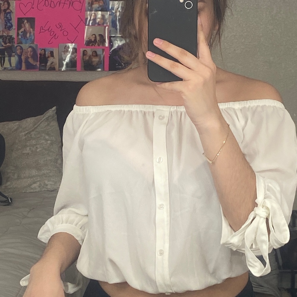 white off the shoulder shirt.